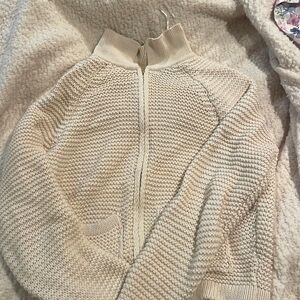 A beige crochet short jacket